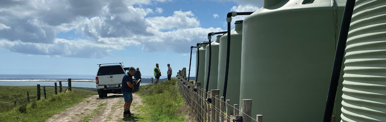 people-looking-at-iplex-water-tanks