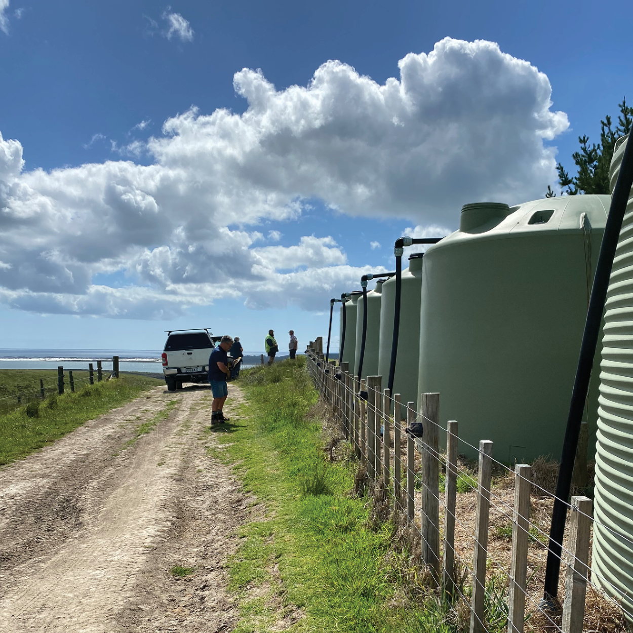 people-looking-at-iplex-water-tanks